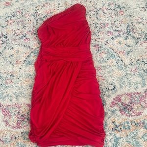 Asymmetrical short red dress in size small.